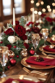 the table is set with red and gold place settings