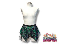 Take a risk and stand out in this handcrafted micro pixie skirt, complete with an elastic waistband and lace-up sides. Perfect for those who love adventure and raves alike. Made to order, pattern placement may vary. Fairy Grunge Fitted Mini Skirt For Summer, Fairy Grunge Mini Skirt For Festival, Fairy Grunge Bottoms For Summer Festival, Fairy Grunge Style Bottoms For Summer Festival, Fairy Grunge Fitted Skirt For Festivals, Summer Fairy Grunge Bottoms For Alternative Fashion, Fairy Grunge Bottoms For Summer, Fitted Fairy Grunge Bottoms For Costume Party, Green Mini Skirt For Festival