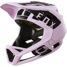 a pink helmet with the words fox on it