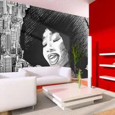 the living room is decorated in red and white with a large marilyn monroe painting on the wall