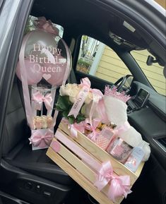 a car filled with lots of pink and white items