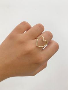 -14k Heart Ring  -100% Gold  -Size 7  -Yellow gold  -Item sold by piece.Weight undetermined. Gold Open Ring Heart Ring For Promise, Gold 14k Heart Ring In Fine Jewelry Style, Gold Open Heart Ring For Promise, Gold Heart Cut Rings For Gift, Gold Rings Heart Cut For Gift, 14k Gold Heart Ring In Fine Jewelry Style, Gold Heart Ring Hallmarked As Gift, Gold Heart Cut Rings For Valentine's Day, Yellow Gold Rings For Valentine's Day Gift