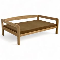 a wooden bed frame with a brown cushion on the top and bottom part, in front of a white background