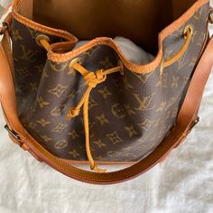 100% Authentic Poshmark Will Authentic Items $500 And Over. Made In France, In 1980s, Date Code Hard To Read, Stamp Shows France With The Small F. Note All Pictures Show Some Minor Cracks, Leather Needs Cleaning. Inside Pretty Clean. Designer Tan Bucket Bag For Travel, Everyday Luxury Monogram Canvas Bucket Bag, Classic Bucket Bag In Monogram Canvas, Designer Brown Bucket Bag, Designer Tan Bucket Bag, Designer Travel Bucket Bag With Branded Hardware, Elegant Everyday Bucket Bag In Monogram Canvas, Designer Brown Bucket Bag With Branded Hardware, Classic Monogram Canvas Bucket Tote Bag