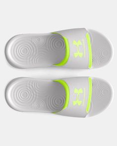 pair of white and neon green slippers