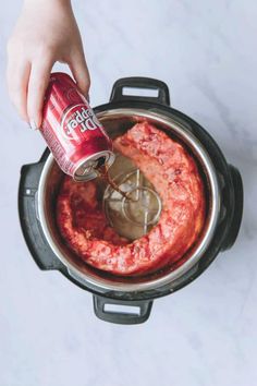 someone is pouring sauce into an instant pot