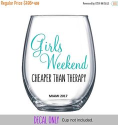 a wine glass with the words girls weekend on it