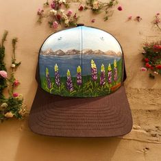 This is a hand painted and washable hat, made in Alaska. Adjustable Hand Painted Summer Hat, Artistic Hand Painted Cap, Casual Hand Painted Cap, Artistic Hand-painted Cap, Adjustable Pink Hand Painted Hat, Casual Hand Painted Hat, Hand Painted Snapback Hat, Casual Hand Painted Hat, One Size Fits Most, Lavender Hat