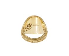 Inspired by history, myths and biology, this Castro Smith signet ring has been carefully hand engraved. The oval 9K yellow gold ring face has been carved with a prancing hare under a crescent moon above tiny mushrooms and leaves. The rest of the composition shows a snapping metal trap and more leaves and mushrooms. Perfect no matter which finger you wear it on. ring face : 3/4" x 5/8"9K yellow gold band width : 5mmsize available : 7please contact us for sizing options Castro Smith Ring, Luxury Carved Yellow Gold Signet Ring, Engraved Oval Symbolic Signet Ring, Heirloom Carved Engraved Ring For Collectors, Ceremonial Engraved Open Signet Ring, Symbolic Intaglio Engraved Ring, Vintage Gold Engraved Skull Ring, Ceremonial Engraved Open Ring With Hallmark, Gold Domed Collectible Ring