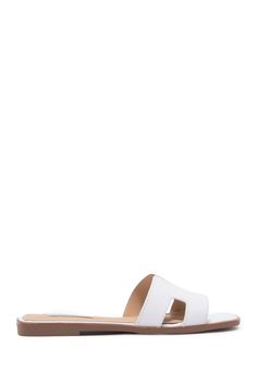 This luxe slide sandal is a contemporary footwear staple that exudes modern flair.Sizing: True to size. Open toe. Strap vamp. Slip-on. Croc embossed (Black croco, cog croco). Lightly cushioned footbed. Mule back. ImportedThis item cannot be shipped to Canada. White Textured Sole Slip-on Slides, Modern Synthetic Mules With Textured Footbed, White Slip-on Sandals With Textured Sole, Modern White Slides With Leather Footbed, White Slip-on Slide Sandals, Modern Open Toe Slides With Cushioned Footbed, Modern Flat Slides With Textured Sole, Modern Synthetic Slide Footbed Sandals, White Slides With Textured Footbed And Flat Heel