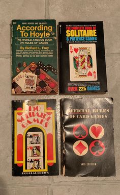 four different types of playing cards on the floor