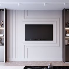 an empty living room with a flat screen tv on the wall and shelves in front of it