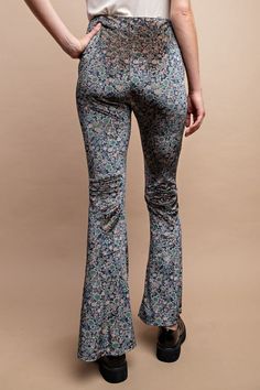 GigioFloral velvet pants with high waist and side zipper. Ditsy floral print, stretchy lightweight fabric, flare hem. Color: Midnight BlueSizes: S-M-LModel is 5' 8" wearing small95% Polyester, 5% Spandex, importedT4/TA2497 Spring Floral Print Flare Bottoms, Floral Print Flare Bottoms For Spring, Stretch Floral Print Pants For Fall, Fitted Floral Print Pants, Fitted Floral Print Pants For Fall, Fitted Floral Print Full-length Pants, Fitted Floral Print Full Length Pants, Floral Print Flare Bottoms With Stretch, Fitted Flare Bottoms With Floral Print