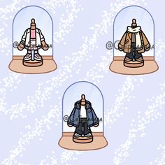 three snow globes with clothes in them on top of each other and one is wearing a jacket