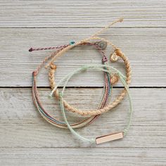 This set from Pura Vida comes with three bracelets; a mint string bracelet with a rose gold bar, a thick cream braided bracelet + multi-colored original string bracelet.  NWOT: The item is in perfect condition  - 100% waterproof - wax coated - adjustable from 2-5 inches in diameter Pura Vida Bracelets Stacked, Summertime Athleisure, Pura Vida Bracelets Aesthetic, Tropical Bracelets, Wax String Bracelets, Puravida Bracelets, Vacation Mountains, Beige Bracelet