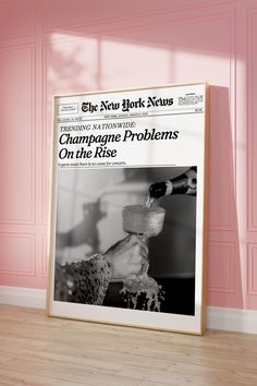 the new york news magazine champagne problems on the rise is displayed in front of a pink wall