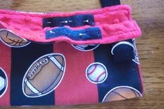 a small purse with sports balls on it