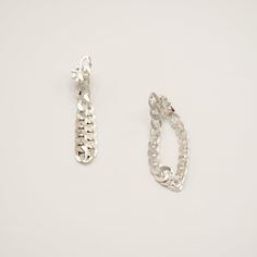 An edgy versatile wardrobe essential, the Dangling Sterling Silver Cuban Chain Earrings were lovingly handmade for the everyday slay in mind. Look like a Rockstar when earrings are worn as a single, paired, or styled asymmetrically with any of our jewelry. Sold as a Single or Pair, for head-turning looks. Solid Sterling Silver Cuban Chain 4.6mm width About 1.75" drop, 3" chain length In-stock jewelry ships within a 2-3 day process. If SOLD OUT on TikTok Shop, pre-order online via link in bio und Silver Cuban Chain, Rachel Brown, Like A Rockstar, Contemporary Fine Jewelry, Tiktok Shop, Cuban Chain, Chain Earrings, Chain Lengths, Wardrobe Essentials