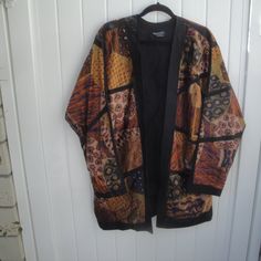 Gorgeous Lagan Look Printed Dolman Sleeve Jacket Lagen Look Printed 100% Cotton Long Open Jacket-Cardigan With Black Lining 2 Front Pockets----Dolman Sleeves Looks Brand New----Excellent Condition Fabric Looks A Little Like Tapestry--- Please Check Measurements Since No Size Label-- 28.5" Pit To Pit J33" Neckline To Hem 2.5" Black Trim At The Bottom Made In Indonesia Lagan Look Tapestry Long Open Kimono Jacket Bohemian Silk Outerwear For Winter, Bohemian Silk Winter Outerwear, Fitted Silk Bohemian Outerwear, Traditional Silk Outerwear For Fall, Multicolor Silk Kimono For Fall, Black Silk Outerwear For Fall, Vintage Black Outerwear With Kimono Sleeves, Long Silk Outerwear For Fall, Design Black Gold