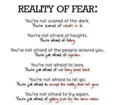 a poem with the words reality of fear written in red and black ink on white paper