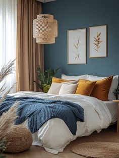 a bedroom with blue walls and white bedding