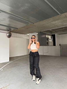 Black Drawcord Cargo Pants Easy and comfy in these black drawcord pants. Chuck on sneakers and a crop top - so effortless yet you're sure to look great! Relaxed Fit Cropped Bottoms For Streetwear, Casual Cropped Pants For Streetwear, Sporty Cropped Bottoms For Streetwear, Black Cropped Streetwear Bottoms, Cropped Black Streetwear Bottoms, Black Cropped Bottoms For Streetwear, Sporty Relaxed Fit Cropped Bottoms, Casual Workout Parachute Pants Relaxed Fit, Casual Workout Parachute Pants With Relaxed Fit