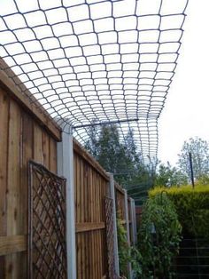 a wooden fence with metal bars attached to it