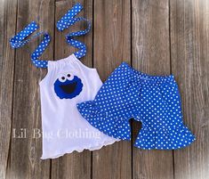 Cookie Monster blue white polka dot short and halter top outfit. Cotton Polka Dot Sets For Summer, Cute Polka Dot Cotton Set, Cute Polka-dotted Cotton Set, Cute Polka Dot Summer Sets, Fun Fitted Blue Set, Cute Polka Dot Sets For Spring, Cute Polka Dot Spring Sets, Polka Dot Fitted Summer Sets, Playful Polka Dot Sets For Spring