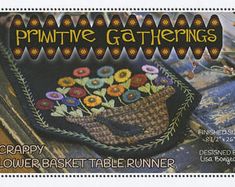 an advertisement for primitive gatherings featuring flowers in a basket