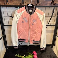 100% Authentic Coach Floral Embroidered Cropped Baseball Jacket Shell: 100% Polyester Lining: 100% Polyester Filling: 100% Polyester Zip Closure, Slip Pockets, Water-Resistant Spring Varsity Jacket With Embroidered Patch And Long Sleeve, Casual Varsity Jacket With Embroidered Patch For Spring, Embroidered Fitted Varsity Jacket For Fall, Trendy Pink Embroidered Outerwear, Spring Varsity Jacket With Embroidered Graphics, Spring Outerwear With Embroidered Logo And Long Sleeves, Spring Long Sleeve Outerwear With Embroidered Logo, White Embroidered Varsity Jacket For Spring, Casual Pink Embroidered Outerwear