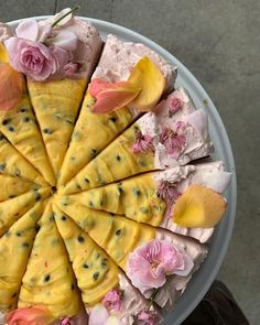 a cake decorated with flowers on top of a white plate