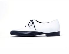 "Black and White Women Oxford Shoes, Custom Made Elegant Wingtip Shoes These are Classic Black and white Saddle Flat Leather Shoes with lace for a comfortable closure. They are comfortable and Chic and will look great with any outfit. We use the finest leather and the most comfortable shoe shape. We use a manufactured durable sole so that you can enjoy the most out of these gorgeous shoes. All of our shoes are handmade, created with careful attention to comfort, detail and style. This style has White Plain Toe Lace-up Shoes For Derby, White Flat Heel Lace-up Office Shoes, White Flat Heel Oxfords For Office, White Lace-up Oxfords For Office, Elegant White Low-top Leather Shoes, White Oxfords For Office, White Lace-up Leather Shoes For Business, White Leather Lace-up Business Shoes, White Pointed Toe Oxfords For Office