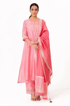 Lotus pink A-line kurta with embroidery along the neckline and sleeves. Paired with a pant and tissue applique work dupatta. - Aza Fashions Pink Palazzo Set With Embroidered Border And Straight Kurta, Pink Embroidered Border Palazzo Set For Navratri, Navratri Pink Palazzo Set With Embroidered Border, Navratri Pink Embroidered Palazzo Set, Festive Anarkali Dupatta With Embroidered Neckline, Festive Dupatta With Embroidered Neckline For Eid, Eid Festive Dupatta With Embroidered Neckline, Festive Wedding Dupatta With Embroidered Neckline, Festive Embroidered Neckline Wedding Dupatta