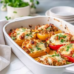 a casserole dish filled with stuffed peppers