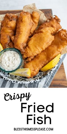 crispy fried fish served on a plate with lemon wedges and tartar sauce