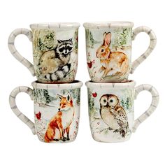 four coffee mugs with animals on them