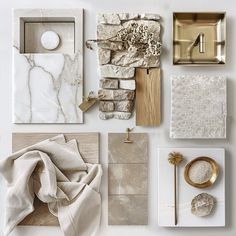 white marble and gold accessories are arranged on the wall