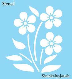 the book cover shows white flowers against a blue background with text that reads,'stencils - by - janie '