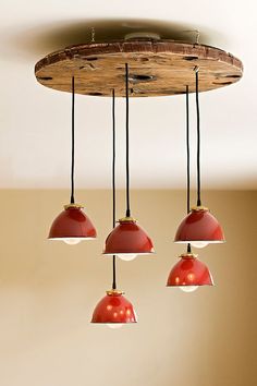 three red lights hanging from a ceiling fixture