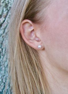 Simple, elegant and classic real pearl stud earrings created with white 5.5mm ROUND genuine freshwater pearls and nickel-free sterling silver stud posts. These are perfect earrings to coordinate with any of the 5.5mm pearl bracelets or necklaces in my shop. This size is appropriate for adults who want a smaller everyday pearl or older children age 6 and up (choking hazard for young children). Arrives on an earring card tucked inside a small gift box. O T H E R . O P T I O N S ~Gold-filled posts: Classic Round Pearl Earrings For Everyday, Classic Pearl Drop Earrings, Classic Silver Pearl Earrings For Everyday, Classic Everyday Nickel Free Pearl Earrings, Classic Nickel-free Pearl Earrings, Everyday Hypoallergenic Pearl White Pearl Earrings, Everyday Round Hypoallergenic Pearl Earrings, Everyday Hypoallergenic Round Pearl Earrings, Minimalist Hypoallergenic Pearl White Pearl Earrings