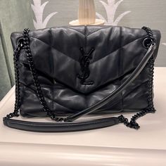 Sleek, Excellent Condition, Leather, Came Straight From The Saint Laurent Store In Northpark Dallas. The Leather Has A Puffy Quality To It, And It Can Be Worn With The Chain Around Your Shoulder Once Or Twice. Designer Black Bag With Chain, Everyday Luxury Black Bag With Chain, Black Chain Bag For Everyday Luxury, Saint Laurent Store, Loulou Puffer, Saint Laurent Bags, The Saint, Saint Laurent Bag, Chain Shoulder Bag