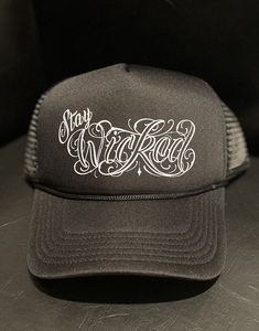 "Wicked Trucker Hats!  Your choice of all black \"Stay Wicked\" logo or the black & white \"Wicked Tooth Gems & Piercing\" logo  One size fits all Unisex" Urban Black Snapback Hat With Letter Print, Black Snapback Hat For Streetwear, One Size, Adjustable Hats With Letter Print For Streetwear, Adjustable Streetwear Hat With Letter Print, Black Hat With Custom Logo For Streetwear, Black Snapback Baseball Cap With Letter Print, Black Hat With Logo Print And Flat Brim, Adjustable Hats With Custom Logo For Streetwear, Black Baseball Cap With Logo For Streetwear