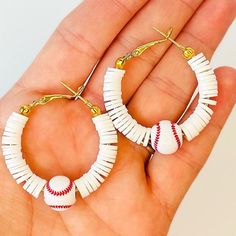 two pairs of white and red baseball themed hoop earrings