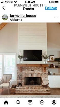 a living room with a fireplace and tv above it