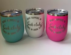 three different colored tumblers with writing on the side and one saying what happens in book clubs?