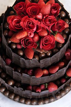 a cake with chocolate and strawberries on top is shown in the app for facebook