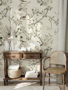 a room with a table, chair and wallpaper