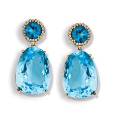 London blue topaz over blue topaz set into 18k yellow gold with diamonds surrounding each upper stone (.288 tcw).Each measures ½" w x 1 ¼" h. Smoky Quartz Earrings, Silver Swan, Lalique Crystal, Leather Photo Albums, Blue Topaz Earrings, Gold Monogram, Shell Bracelet, Stud Set, Topaz Earrings