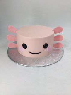 a cake that has been decorated to look like an octopus on top of a plate