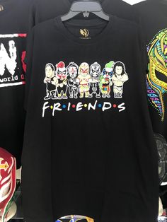 t - shirts with the word friends on them are hanging up in a store window